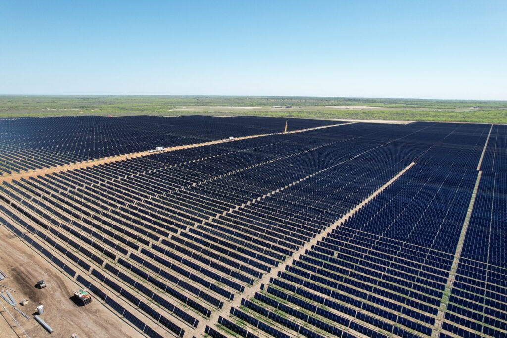 Thousands of solar panels on a stark vast landscape